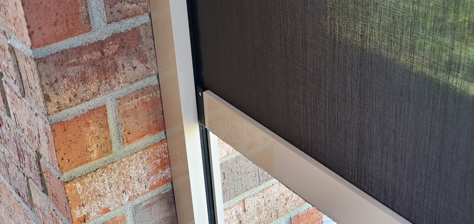 Exterior roller shades on a covered porch