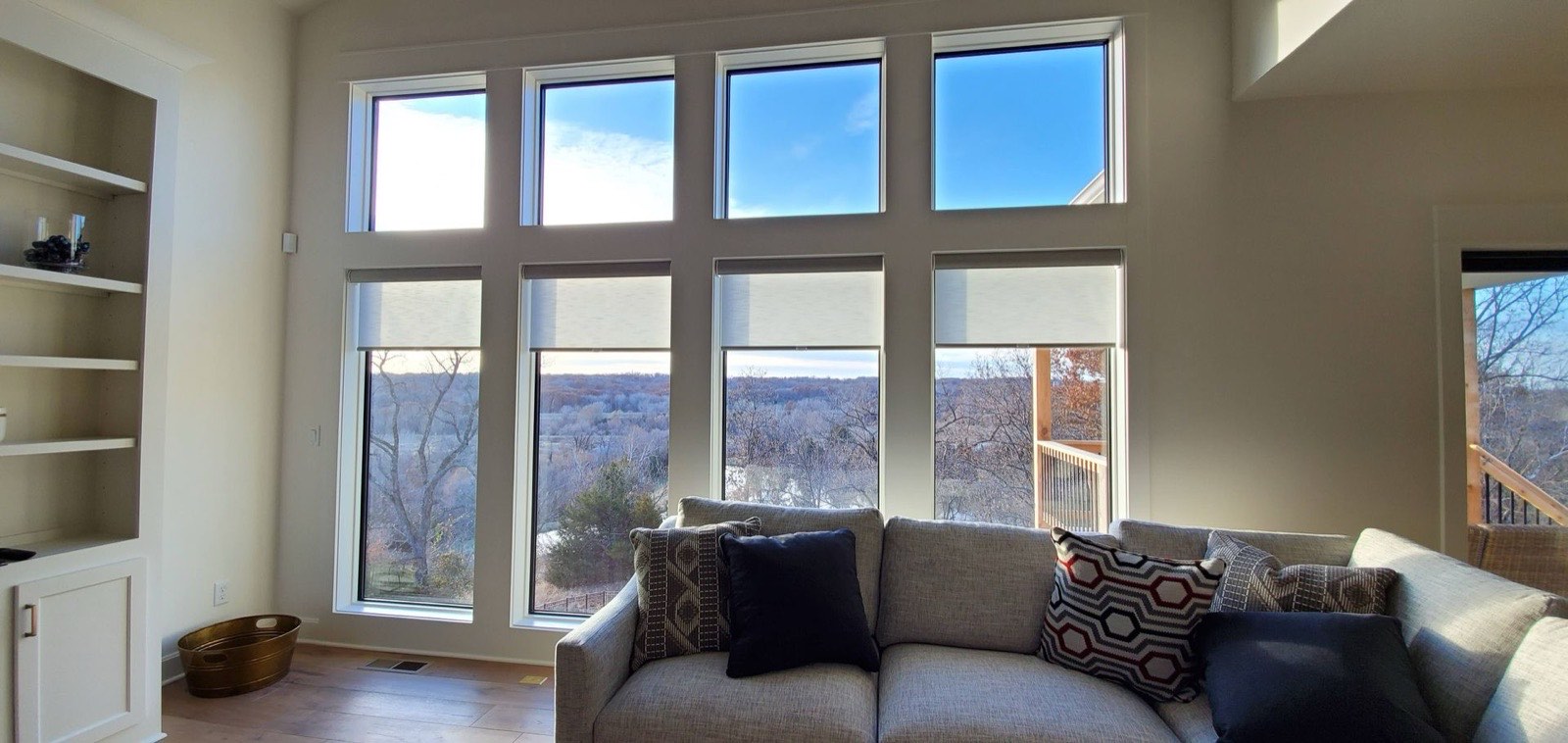 Roller shades on a triple living room window